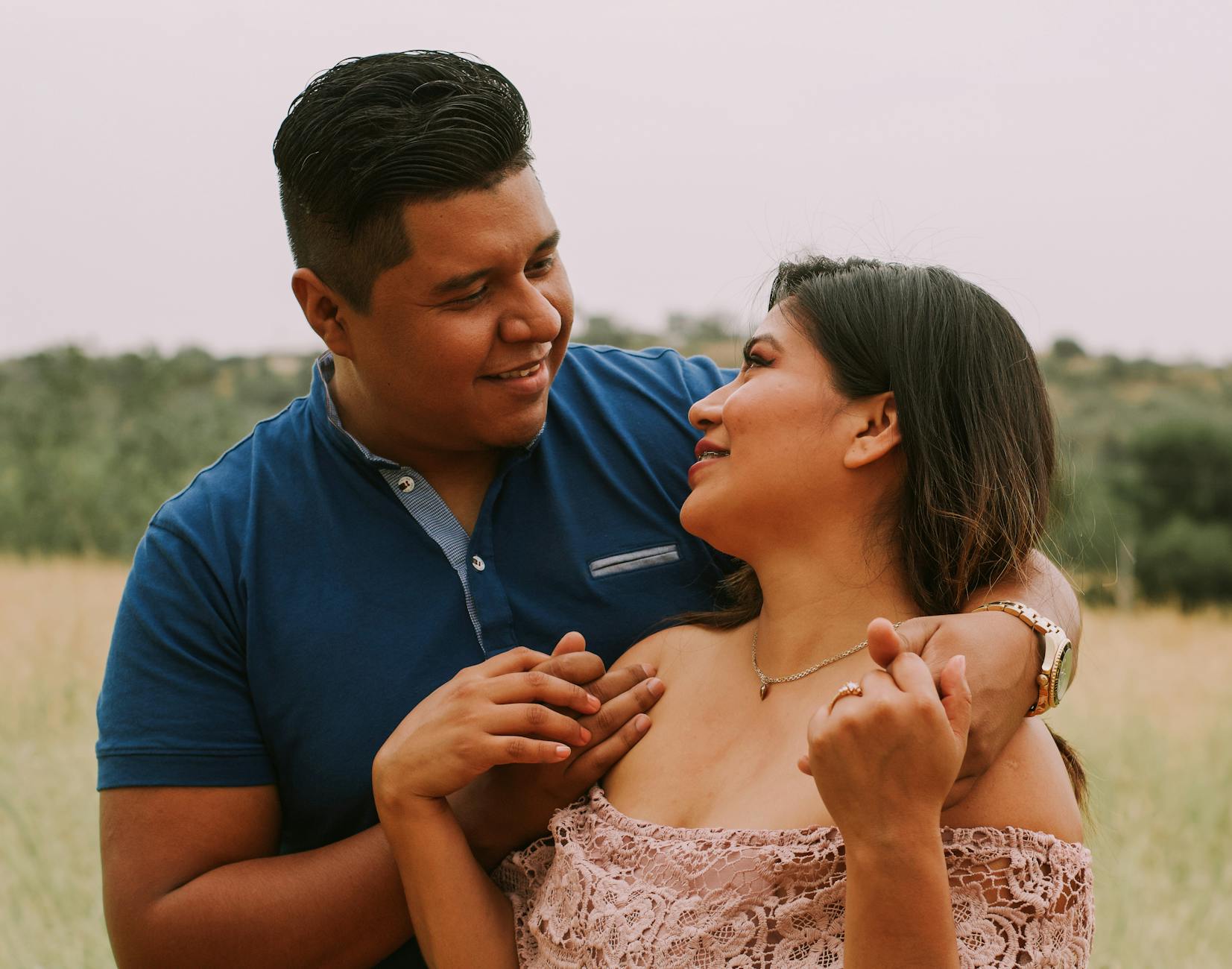 happy adult couple enjoying each other in nature